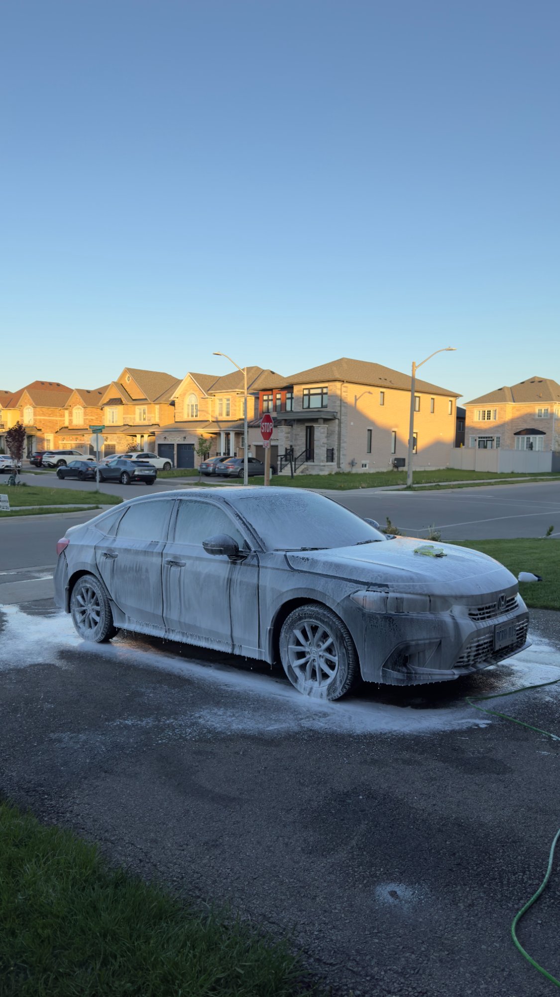 RSK Auto Detailing — Honda Civic foam wash at golden hour in Hamilton